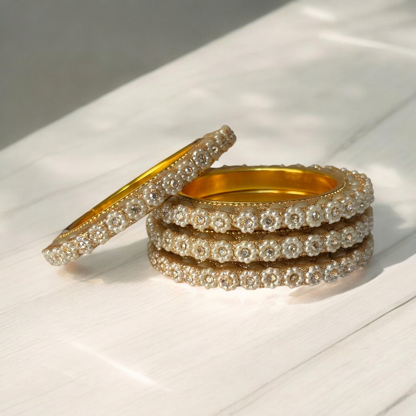 Floral Pearl & Stone Bangles – Elegant Gold Finish (Set of 4)