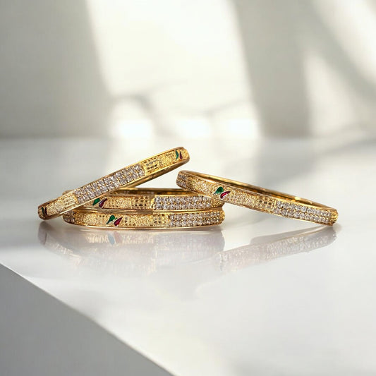Elegant Gold Bangles with Diamond Accents and Meenakari Detailing – Set of 4