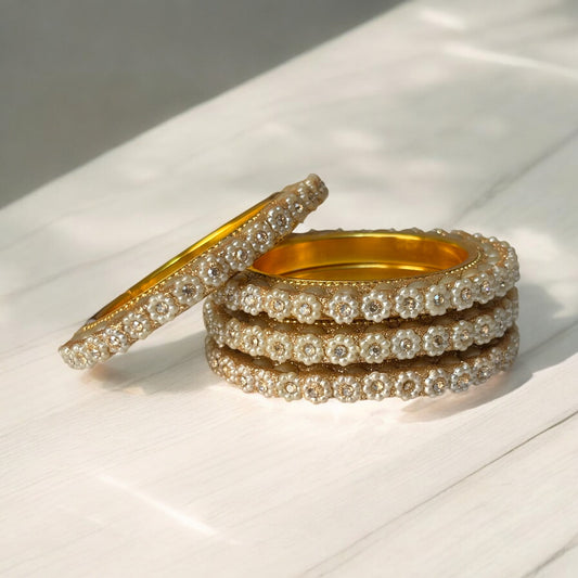 Floral Pearl & Stone Bangles – Elegant Gold Finish (Set of 4)
