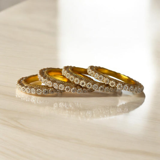 Floral Pearl & Stone Bangles – Elegant Gold Finish (Set of 4)